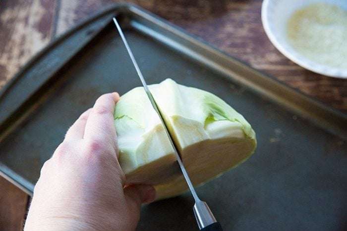 Cut each half of cabbage in half again.